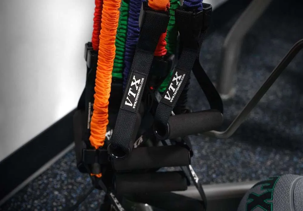 Close-up of resistance bands hanging in a gym